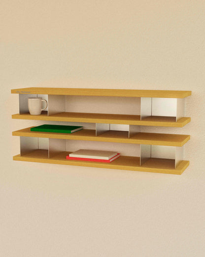 Wooden shelf with books and a mug on a beige wall
