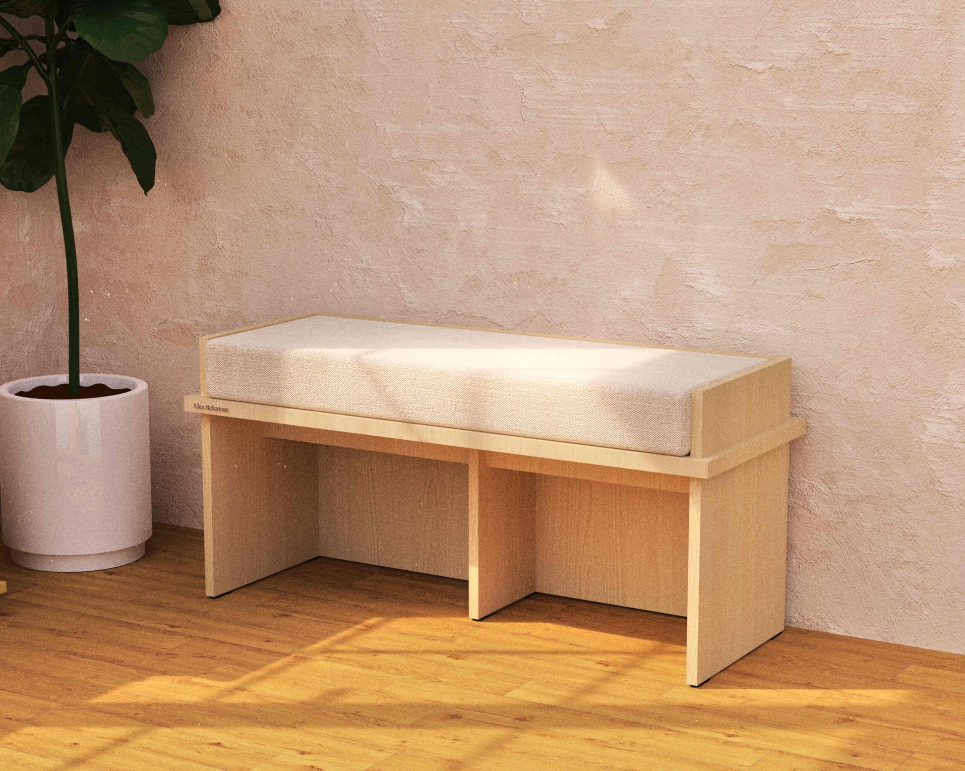 Wooden bench with a cushion against a beige wall