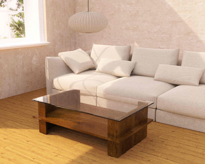 Light gray sectional sofa with a wooden coffee table in a living room setting.