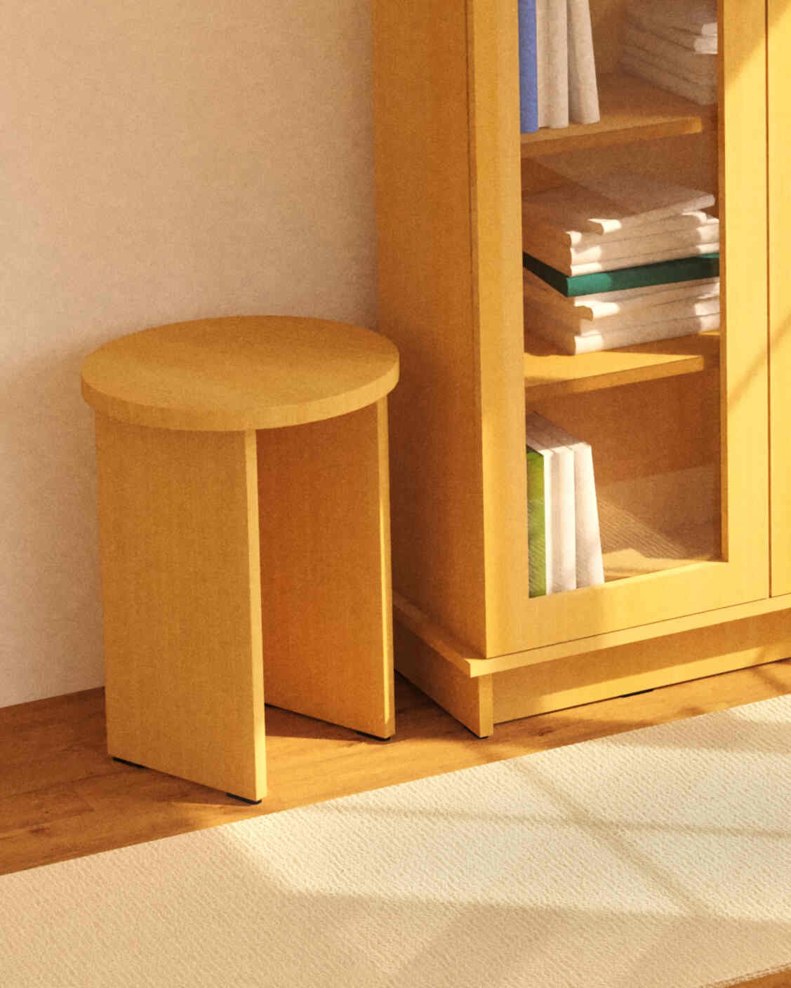 Wooden stool next to a wooden bookshelf with books on a light-colored floor.